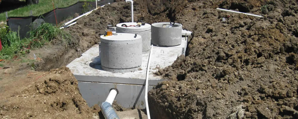 Septic system repair and installation site with tank access ports in Orange, CA